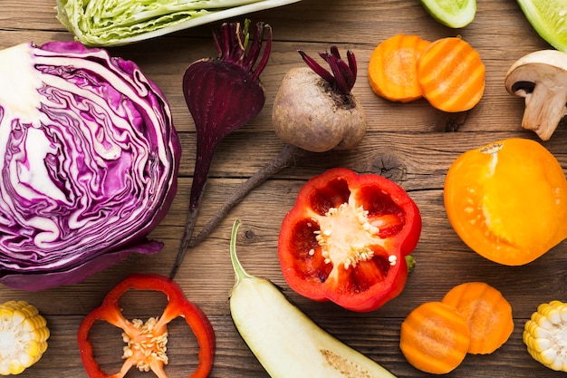 Top view vegetables composition on wooden background