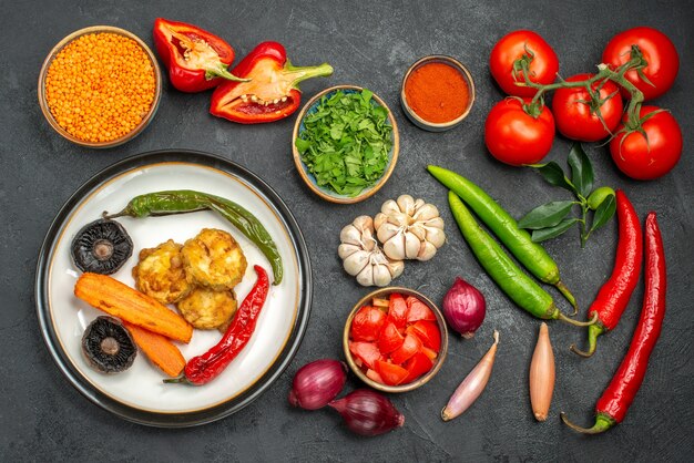 Top view of vegetables lentil in bowl colorful vegetables spices dish of peppers mushrooms