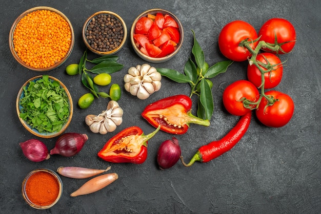 Top view of vegetables lentil spices herbs citrus fruits with leaves tomatoes hot peppers