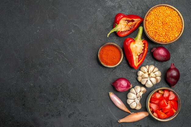 Top view of vegetables lentil spices tomatoes garlic onion peppers