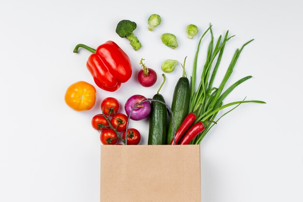 Top view vegetables and paper bag