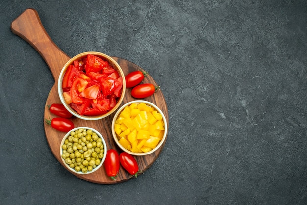 Top view of vegetables on plate stand with free space for your text on dark grey background