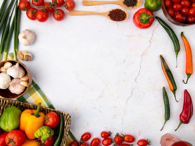 Top view of vegetables on white surface