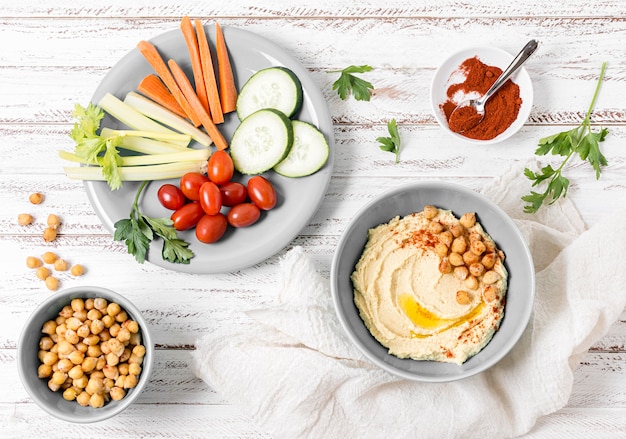 Top view of vegetables with hummus