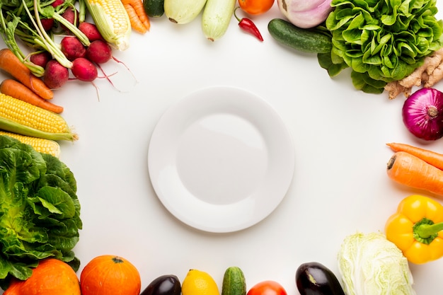 Top view veggies frame with empty plate