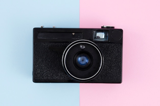 Top view vintage photo camera with colourful background