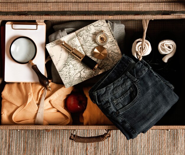 Top view vintage suitcase with casual clothes