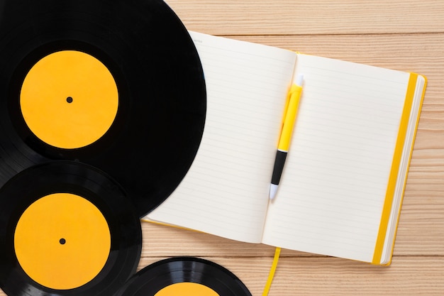 Top view vinyl discs with a notebook