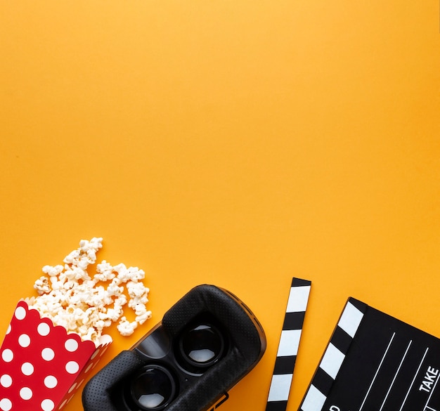 Top view virtual reality headset and popcorn