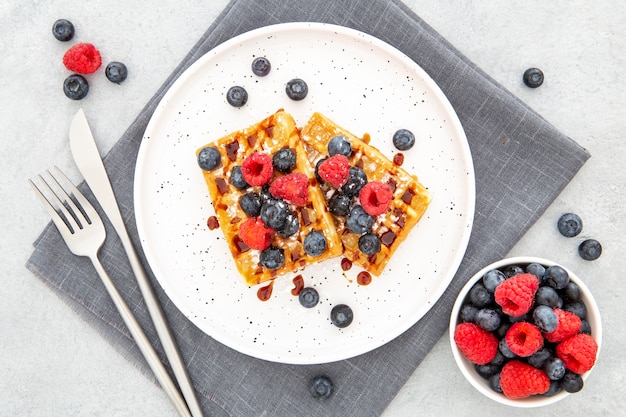 Top view waffle on plate with forest fruit