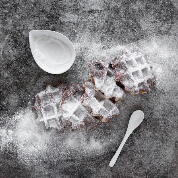 Top view of waffles dusted with powdered sugar