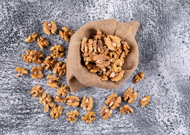 Top view walnuts in sack on stone  horizontal