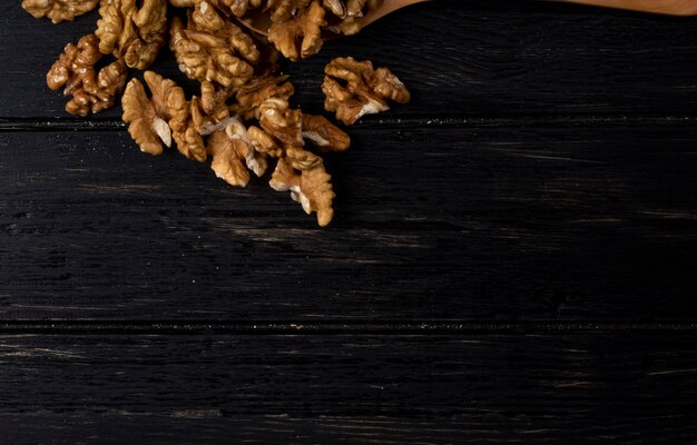 Top view of walnuts with copy space on rustic