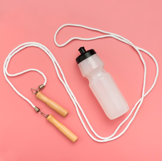 Top view of water bottle with jump rope