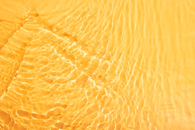 Бесплатное фото Текстура воды вид сверху на оранжевом