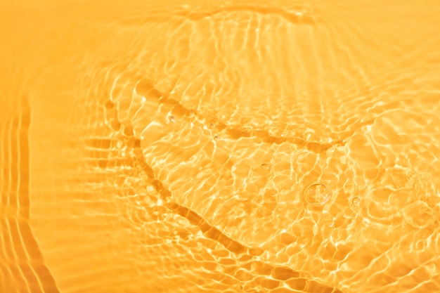 Free photo top view water texture on orange