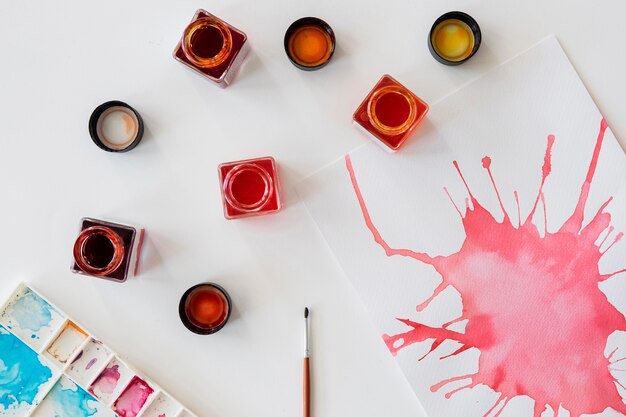 top view of watercolors and brush