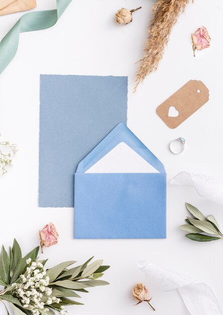 Top view wedding card and engagement ring