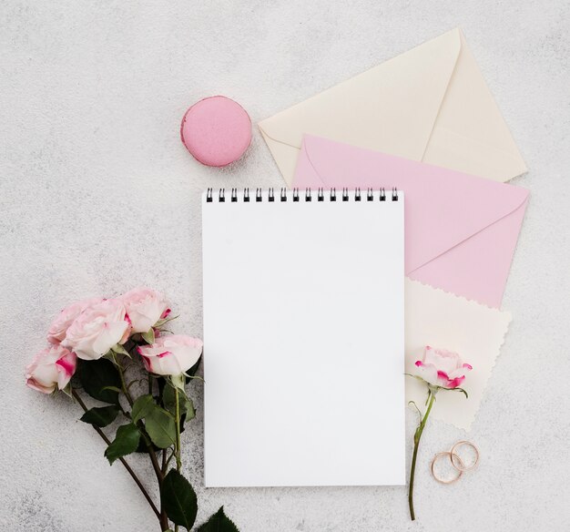 Top view wedding invitation envelopes with flowers