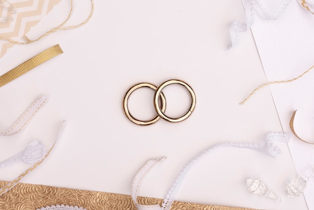 Free photo top view wedding rings with decorations