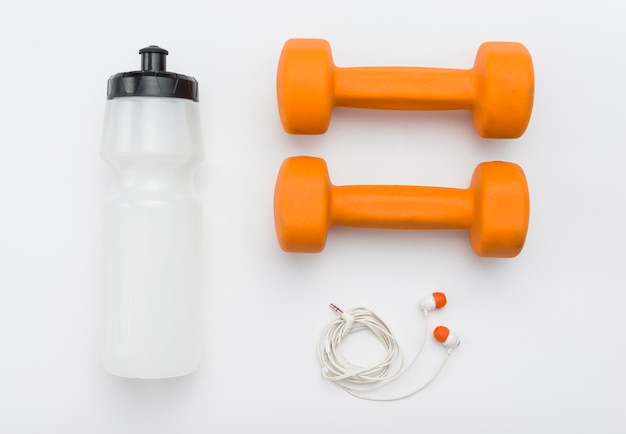 Top view of weights with earphones