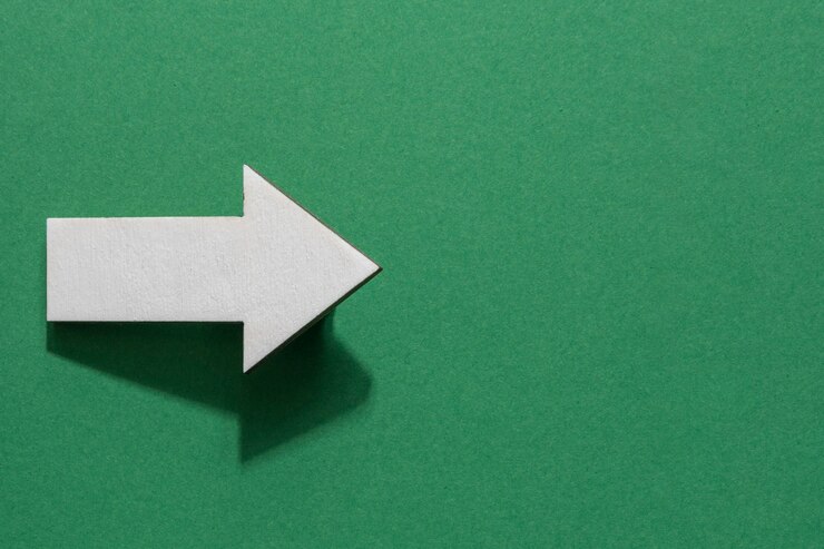 Free Photo top view white arrow with copy-space