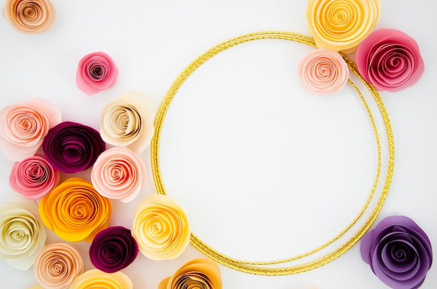 Free photo top view white background with paper flowers frame