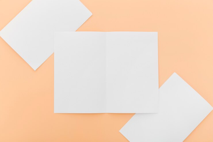 Free Photo top view white brochure collection