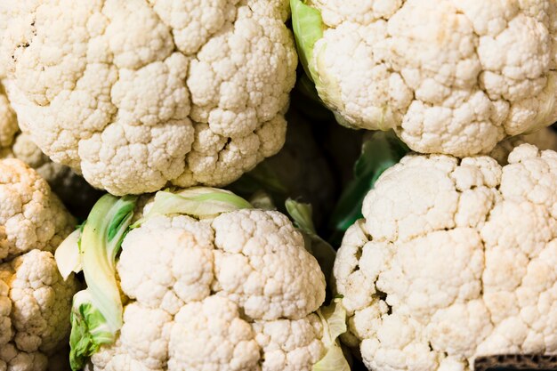 Top view white cauliflowers pile