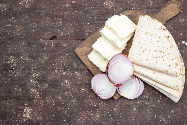 Top view white cheese onions sliced on the grey desk with lavash food vegetable meal photo