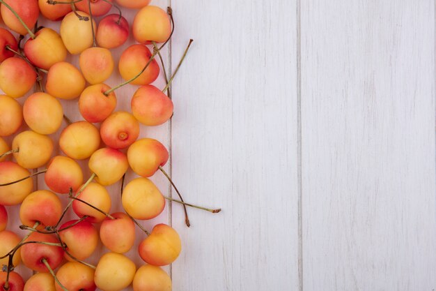 Free photo top view of white cherry on a white surface