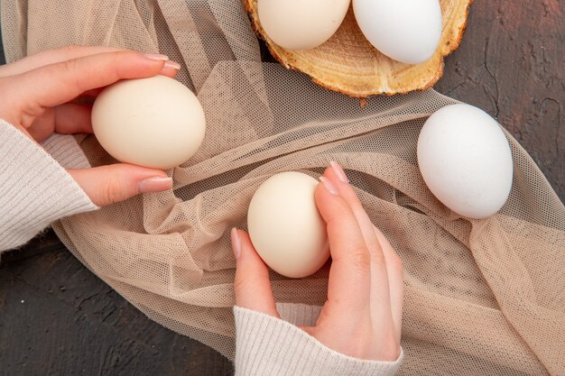 Top view white chicken eggs on dark table meal animal raw photo farm breakfast color