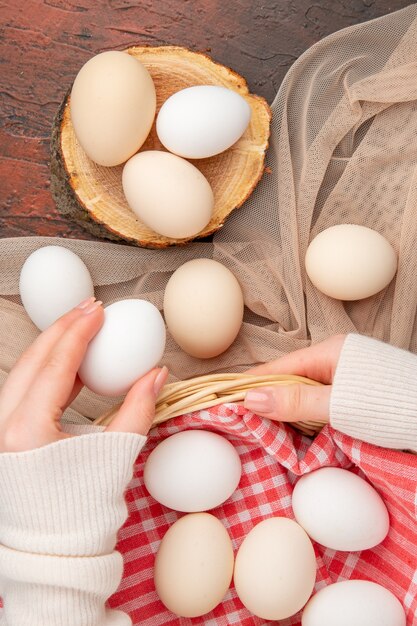 Top view white chicken eggs on dark table