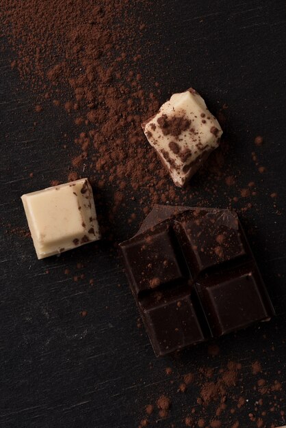 Top view of white and dark crashed chocolate bar tiles