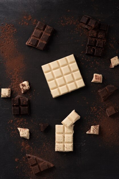 Top view of white and dark crashed chocolate bar tiles