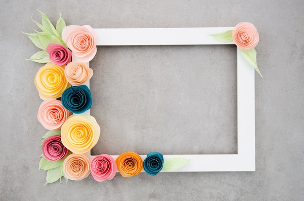 Top view white elegant floral frame on cement background