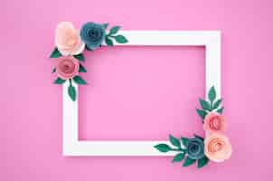 Free photo top view white floral frame on pink background