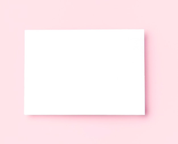 Вид сверху белая рамка на розовом фоне