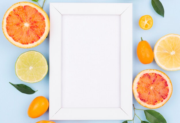 Top view white frame with organic fruits