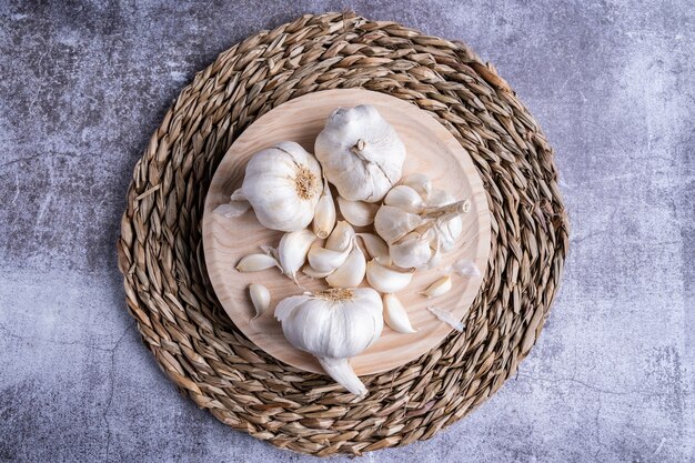 Top view of white garlic on a special board