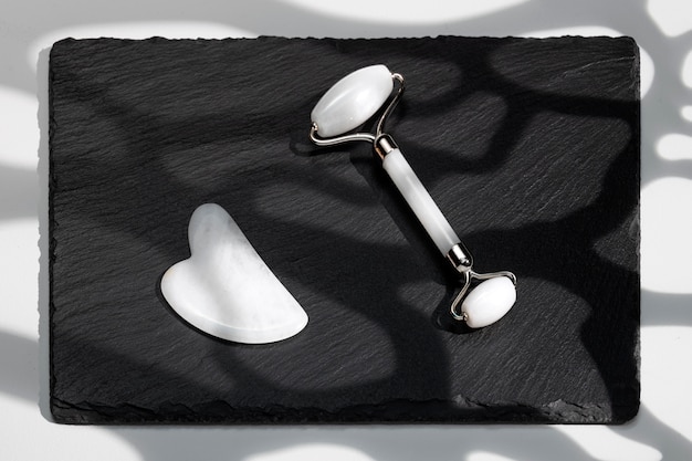 Free photo top view white gua sha tools arrangement