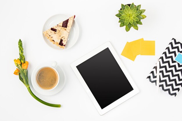 Top view of white office female workspace with laptop