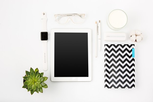 Top view of white office table with laptop