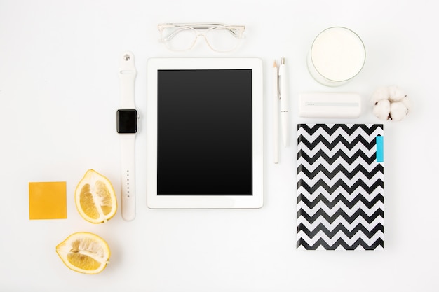 Top view of white office table with laptop