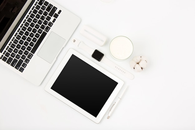 Top view of white office table with laptop