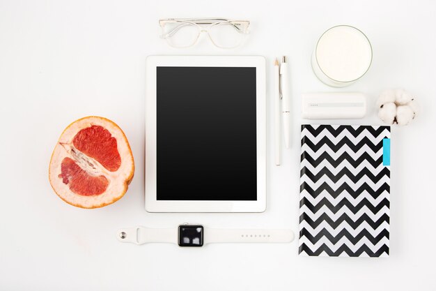 Top view of white office table with laptop