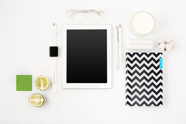 Top view of white office table with laptop