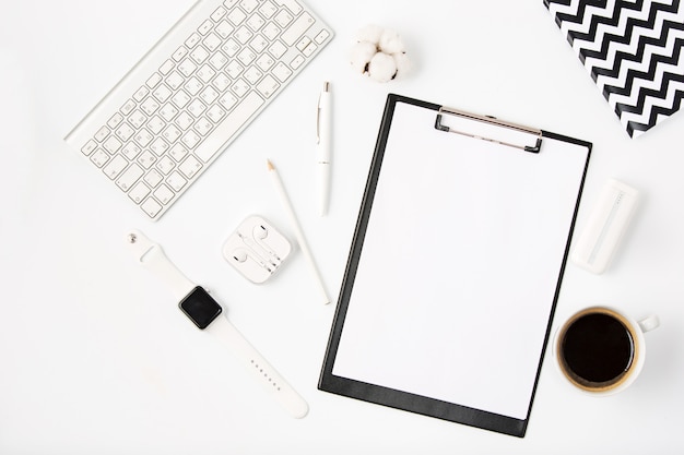 Top view of white office table with notebook