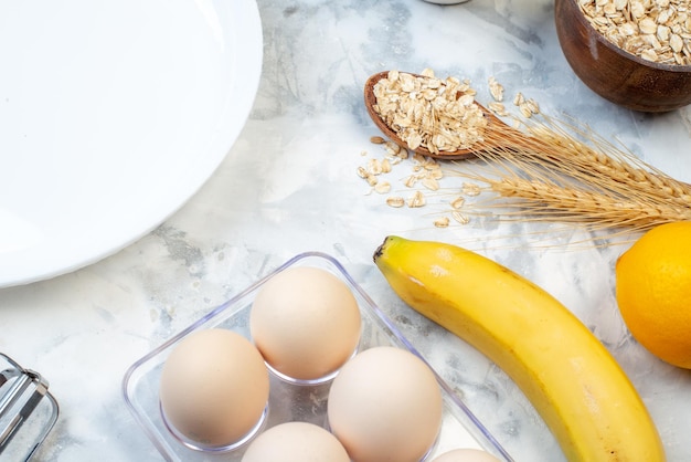 Top view of white plate and ingredients for the healthy foods selection on ice background