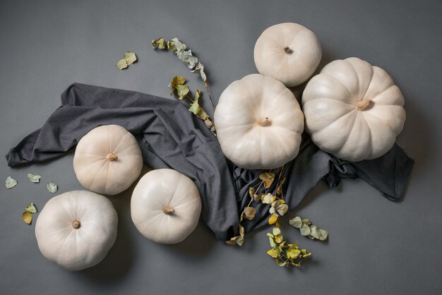 Top view white pumpkins and cloth